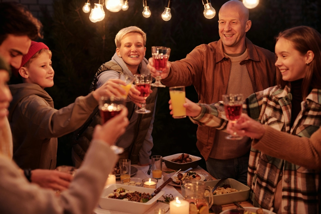 Family outside dark with drinks