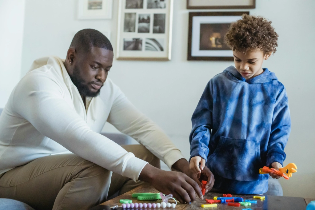 african american father and son playing