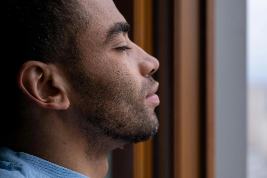 anxiety african amercian man with eyes closed