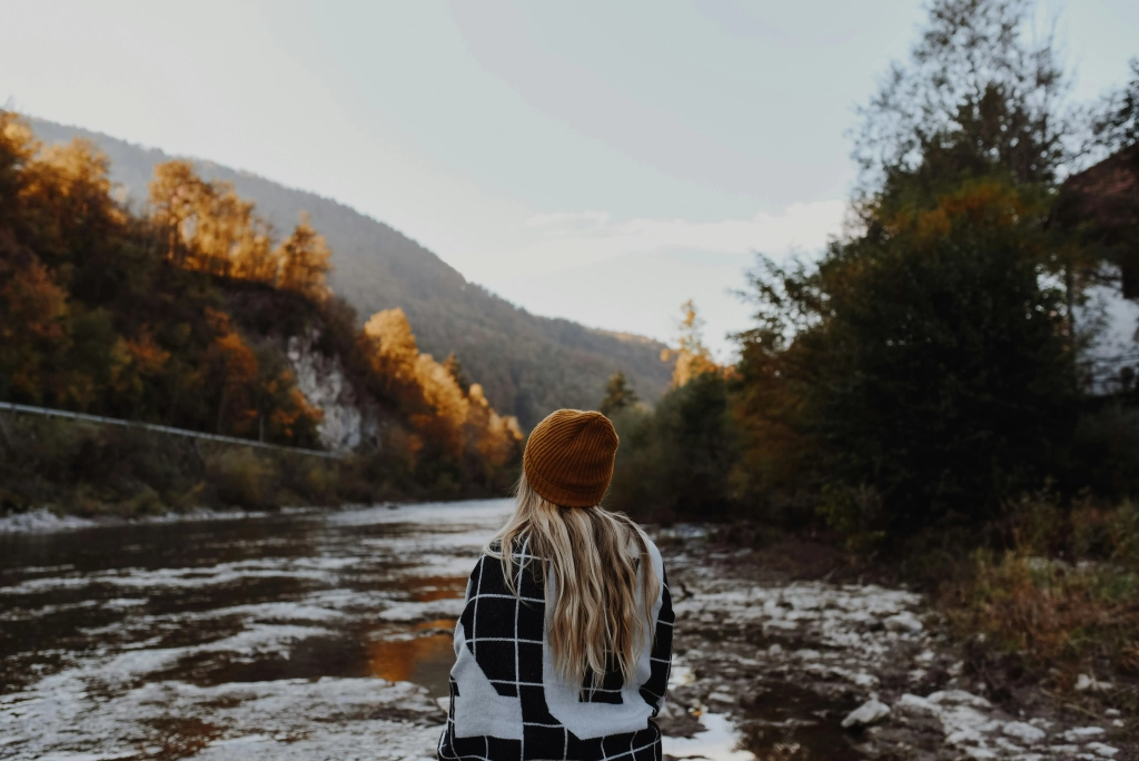 Anxiety blond woman facing lake