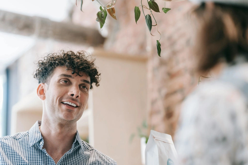 man talking to someone in a public place