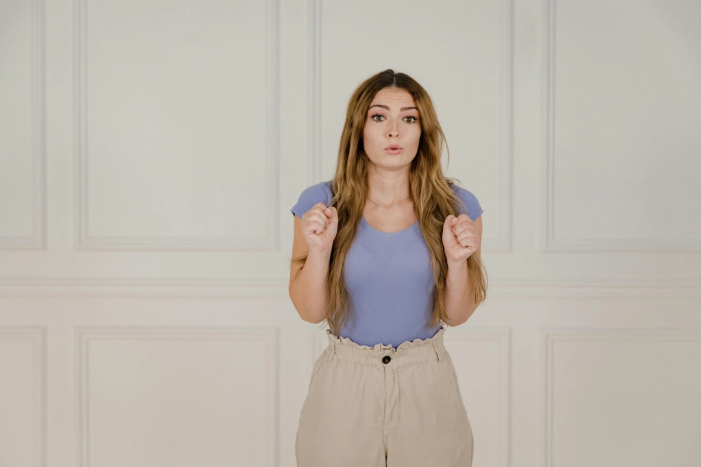 Caucasian woman exhibiting fear indoors in Cochrane & Calgary, facing her phobia with Najwa Zahr's therapy.